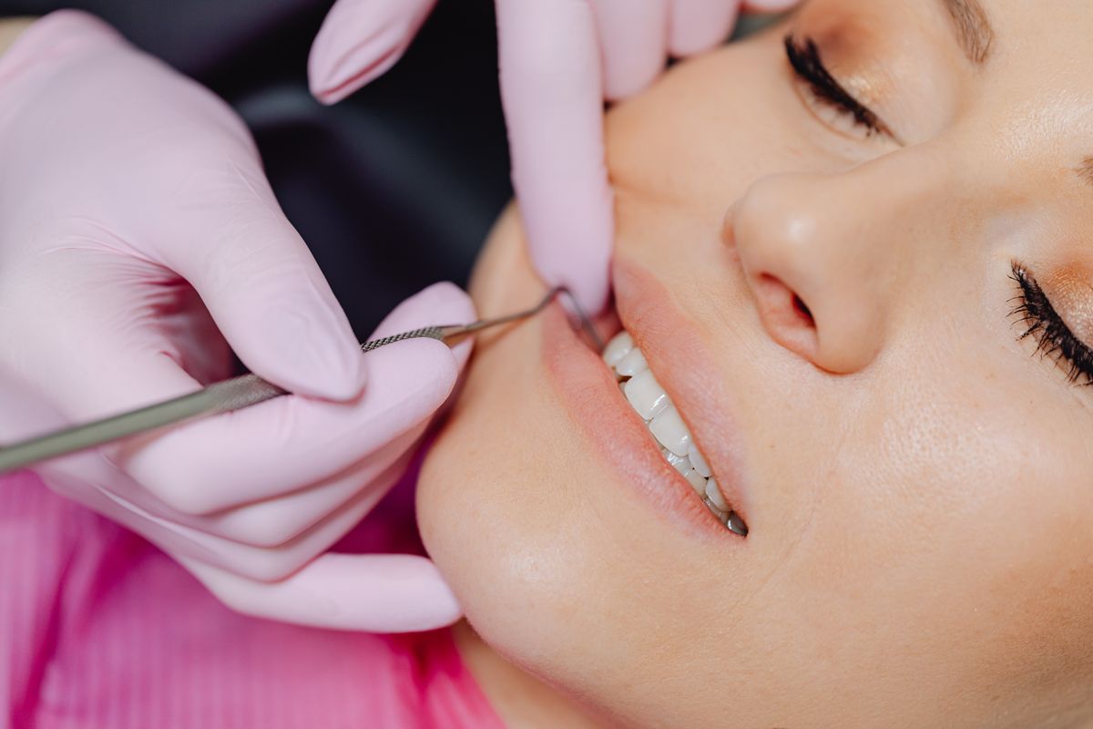bleeding gums vashi — dentist examining a patient's gums during a checkup in Navi Mumbai
