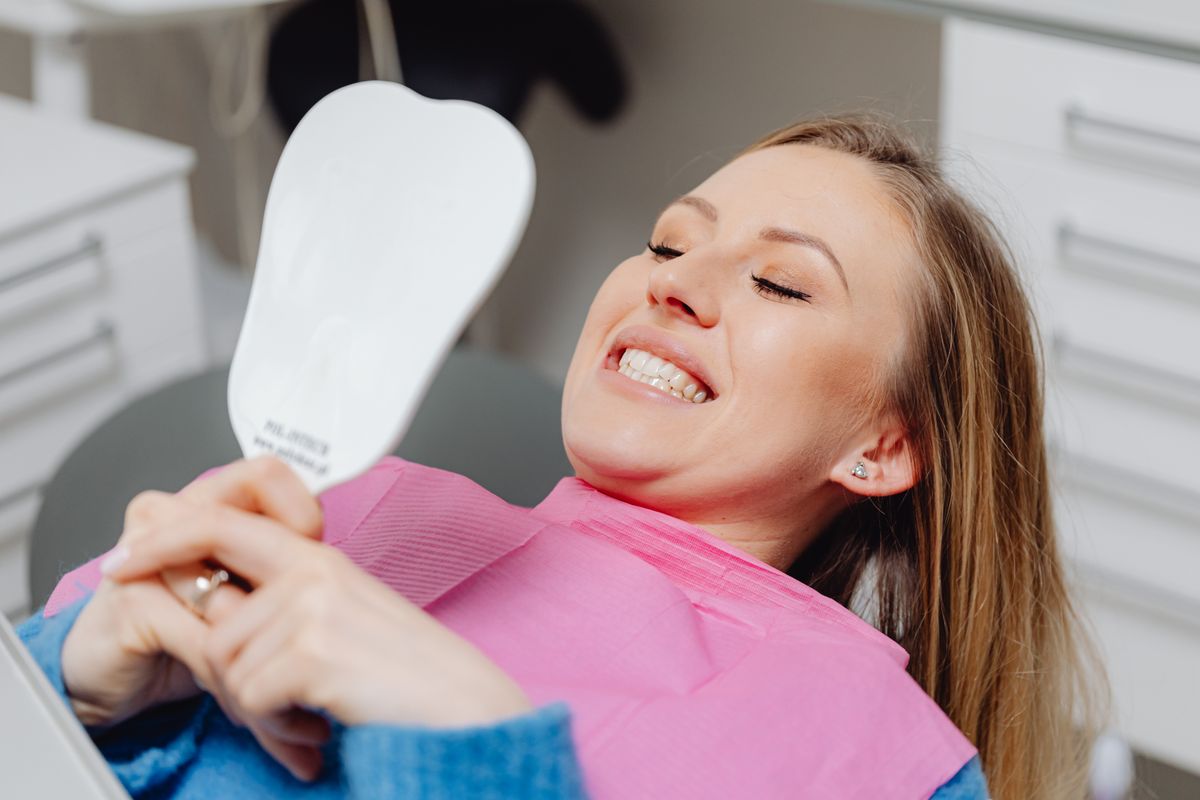 composite bonding vashi cosmetic dentist reviewing a patient's smile at a Sector 17 Navi Mumbai clinic