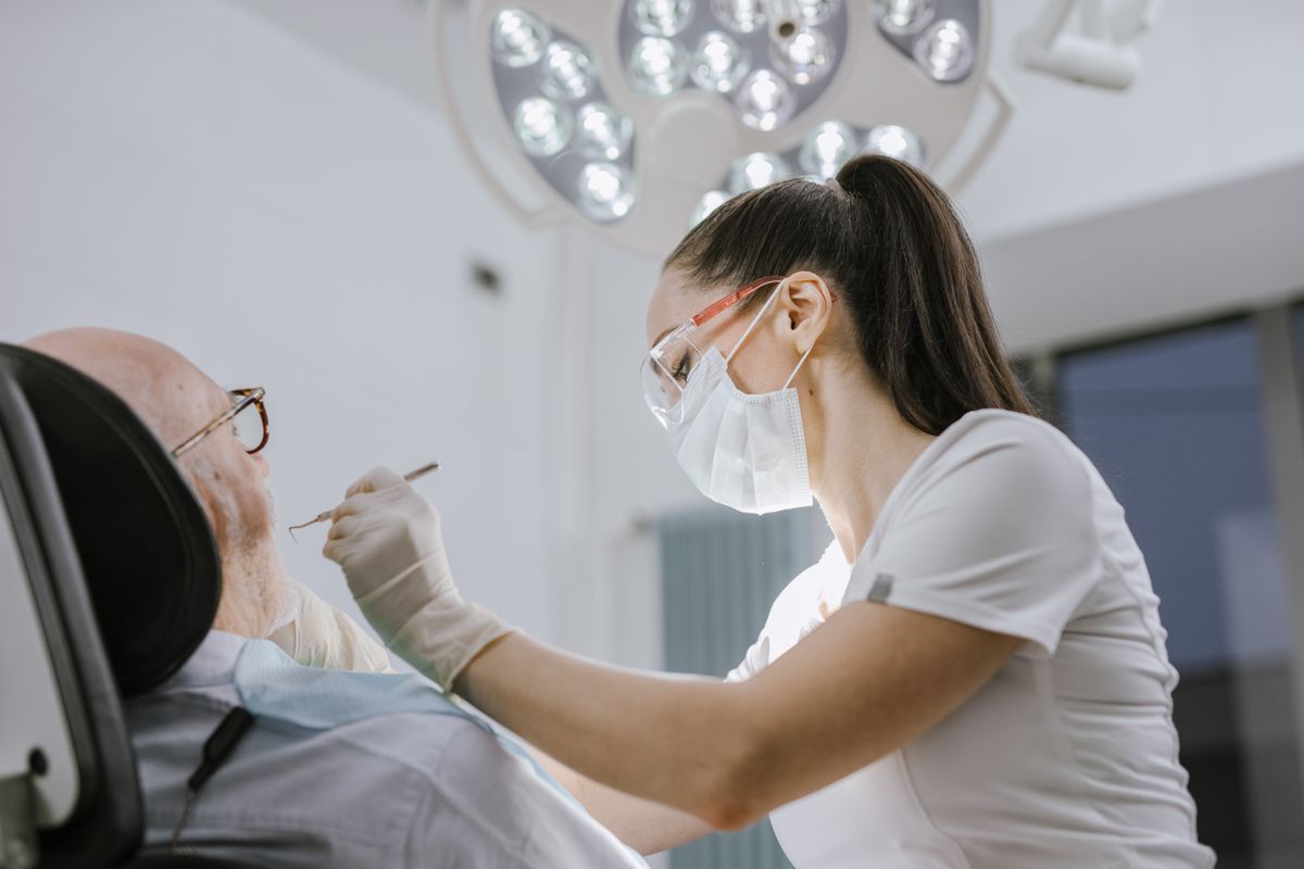 root canal cost Vashi dentist examining a patient at a Sector 17 Navi Mumbai dental clinic