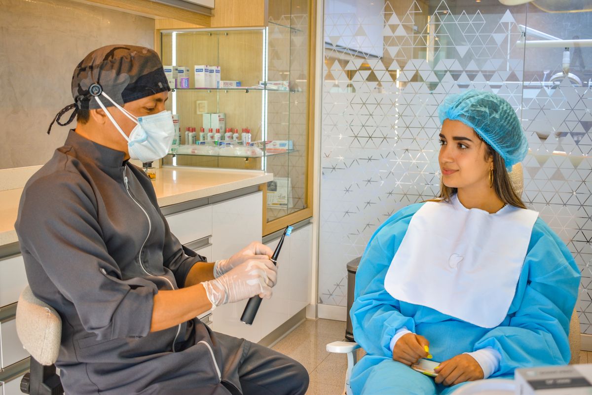 tooth extraction cost vashi dentist consultation with patient at a Sector 17 Navi Mumbai clinic